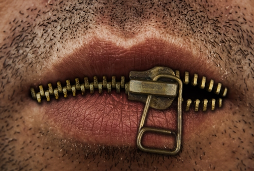 photo of a mouth with a zipper for lips