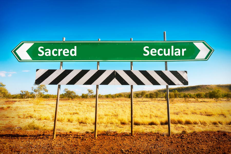 Road sign with secular or sacred direction choice