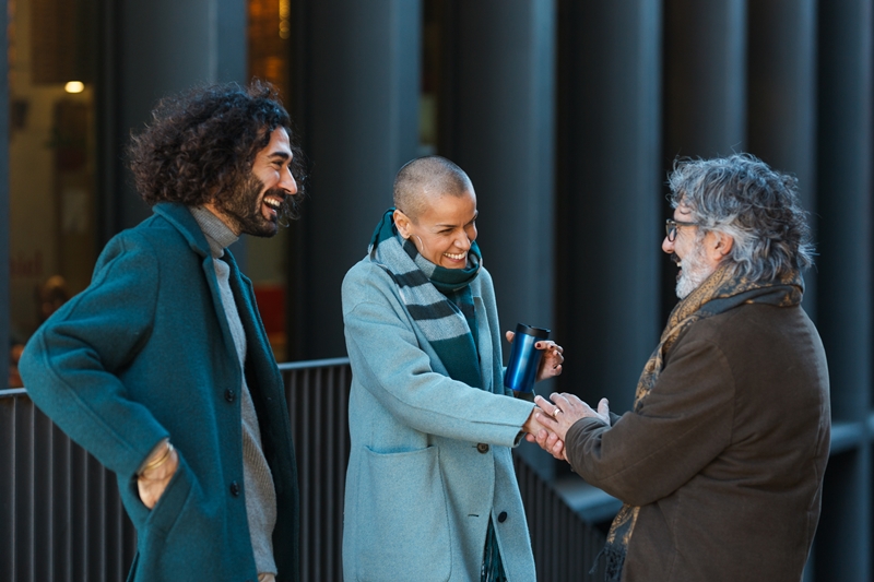 Catholic Professional business people talking and meeting on the street.