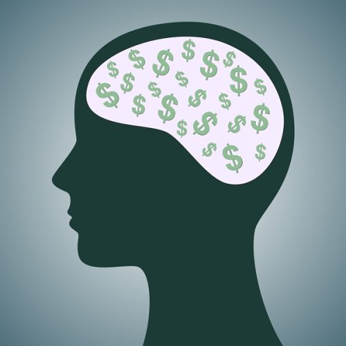 A side view crawing of a head with dollar signs in it.