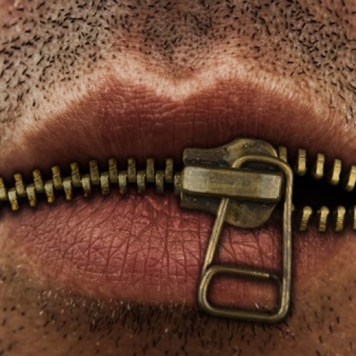 photo of a mouth with a zipper for lips