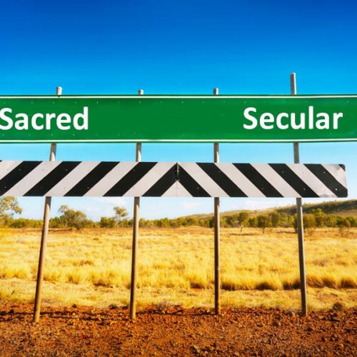 Road sign with secular or sacred direction choice