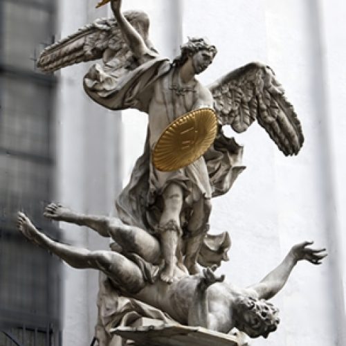 Statue of Saint Michael with gold shield and sword in center of Vienna, Austria